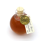 Shipwreck Apiaries Raw Honey 8oz glass flagon in both Blackberry Blossom Honey or Wildflower Blossom Honey top view