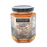Shipwreck Honey Raw Honey 9oz hex jars in signature Wildflower Blossom Honey Front Label