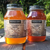 Shipwreck Honey Raw Honey 1 Quart Jars in Wildflower Blossom Honey (left) Blackberry Blossom Honey (right) from our hives to your home.