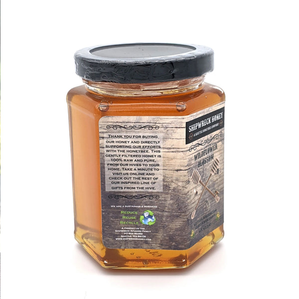 Shipwreck Honey Raw Honey 9oz hex jars in signature Wildflower Blossom Honey side thank you for buying our honey and directly supporting our efforts with the honeybee. 